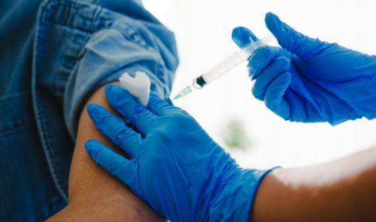 Male patient receiving vaccination