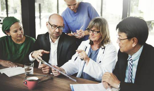 Group of associates and physicians talking