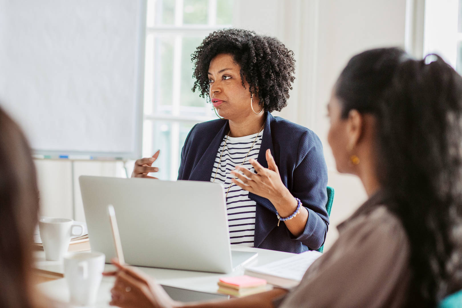 Group of World Courier associates having a business meeting