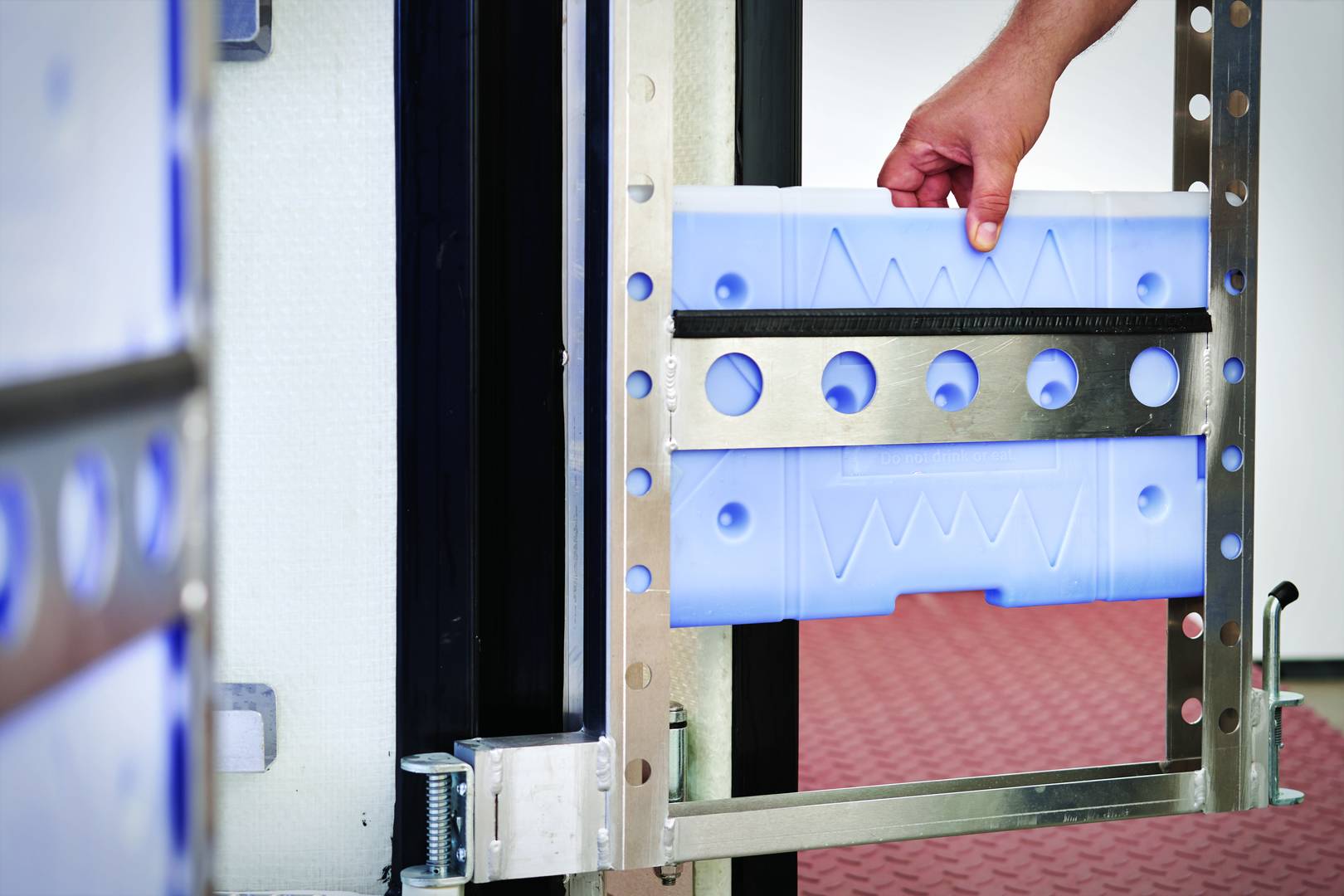 Someone loads a cooling gel pack into Cocoon's internal frame.